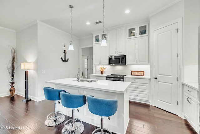 35 Enclave Cir, Ridgeland, MS 39157 - kitchen featuring appliances with stainless steel finishes, a sink, a center island with sink, backsplash, and recessed lighting