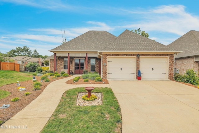35 Enclave Cir, Ridgeland, MS 39157 - view of front of home with brick siding, roof with shingles, an attached garage, and concrete driveway