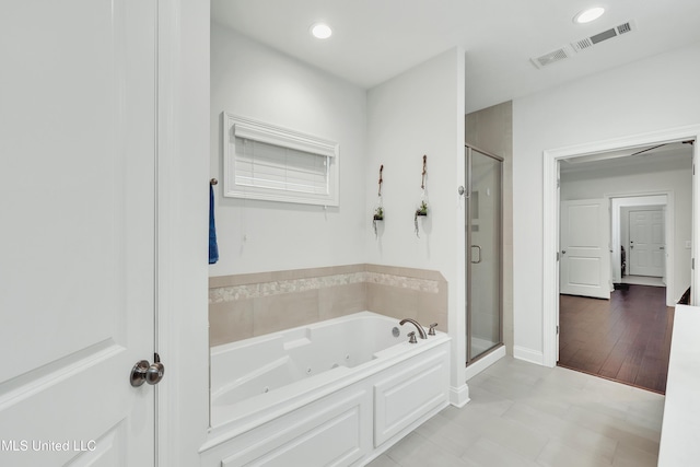 35 Enclave Cir, Ridgeland, MS 39157 - bathroom with a jetted tub, a shower stall, and recessed lighting