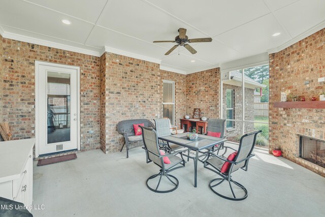 35 Enclave Cir, Ridgeland, MS 39157 - view of patio with outdoor dining area, ceiling fan, and an outdoor fireplace