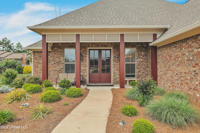 35 Enclave Cir, Ridgeland, MS 39157 - view of exterior entry with roof with shingles, brick siding, and french doors