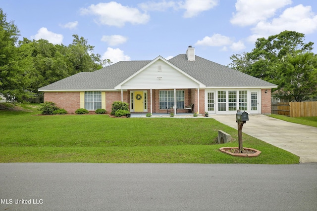 traditional-style house featuring a chimney, brick siding, covered porch, and a shingled roof