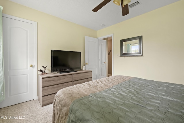 bedroom featuring light colored carpet and ceiling fan