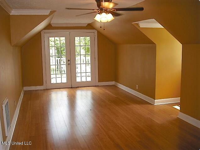 1105 Military Rd, Columbus, MS 39701 - bonus room featuring a ceiling fan, wood finished floors, and lofted ceiling