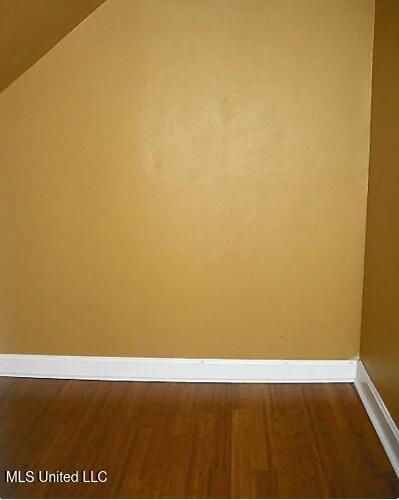1105 Military Rd, Columbus, MS 39701 - detailed view of wood finished floors and baseboards