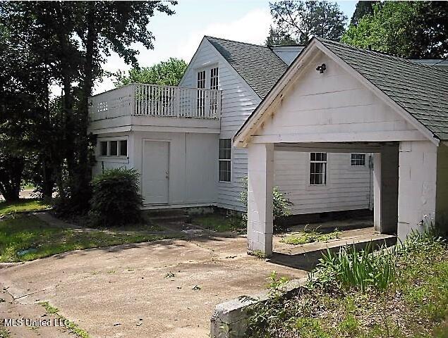 1105 Military Rd, Columbus, MS 39701 - rear view of property with a balcony and a shingled roof