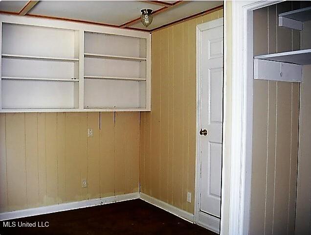 1105 Military Rd, Columbus, MS 39701 - laundry area featuring wood walls