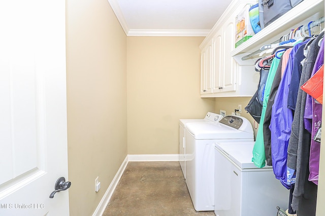 laundry area with ornamental molding, cabinet space, baseboards, and separate washer and dryer