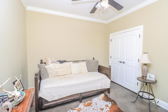 bedroom with concrete floors, a ceiling fan, baseboards, a closet, and crown molding