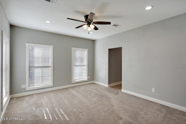 carpeted empty room with ceiling fan