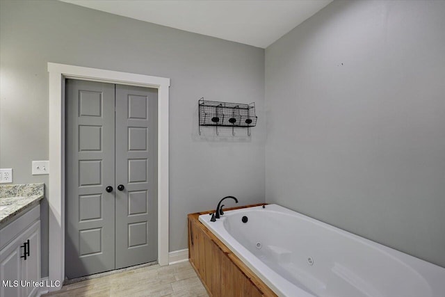 bathroom featuring a bathtub and vanity