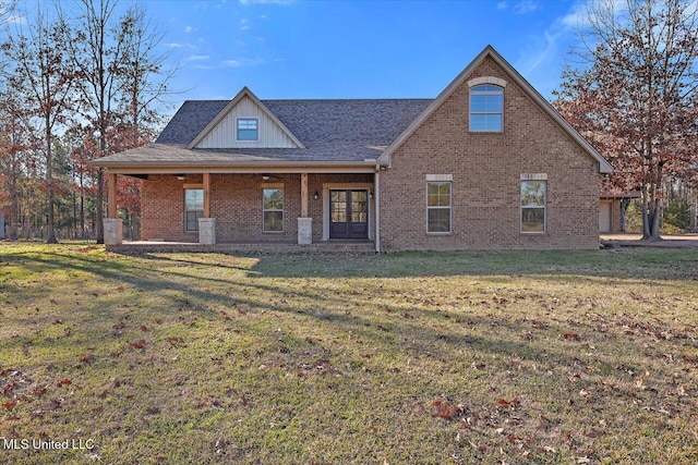 rear view of house with a yard