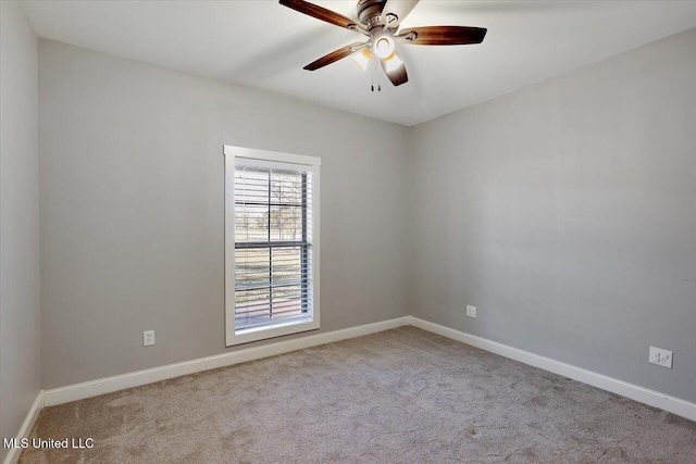 empty room featuring ceiling fan and light colored carpet