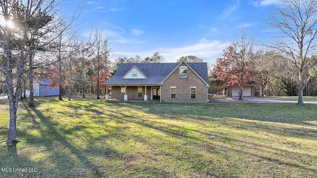 view of front facade featuring an outdoor structure, a front yard, and a garage