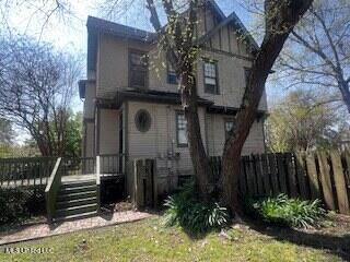 56 John St, Clarksdale, MS 38614 - view of front facade with a wooden deck