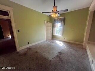 56 John St, Clarksdale, MS 38614 - unfurnished bedroom featuring carpet flooring and baseboards