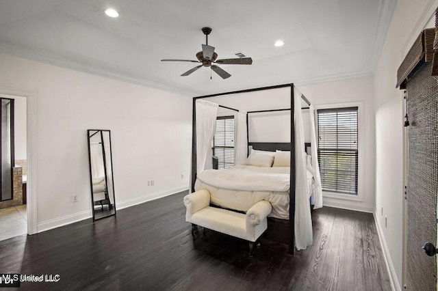 bedroom featuring a raised ceiling, ceiling fan, crown molding, and dark hardwood / wood-style floors