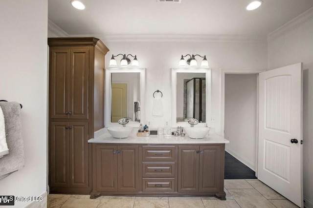 bathroom with tile patterned flooring, vanity, and ornamental molding