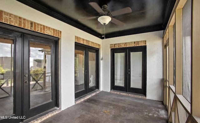 property entrance featuring ceiling fan and french doors