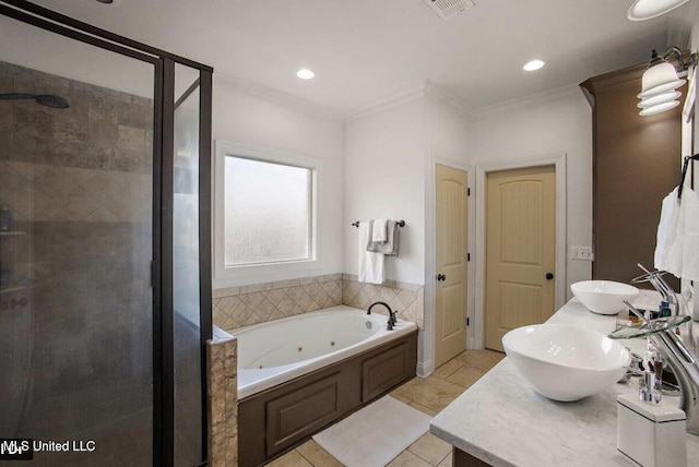 bathroom with tile patterned floors, vanity, separate shower and tub, and crown molding