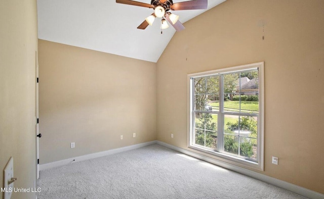 carpeted empty room featuring ceiling fan, a healthy amount of sunlight, and lofted ceiling