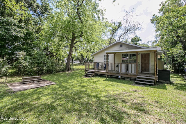 back of house featuring a lawn