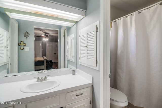 full bath with ceiling fan, toilet, and vanity
