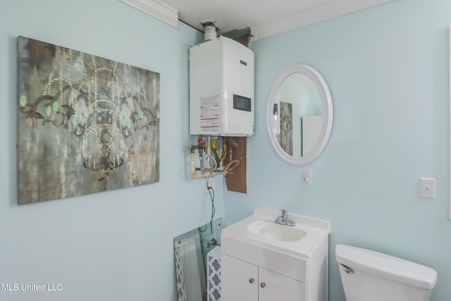 half bathroom with water heater, toilet, and vanity