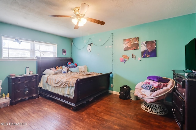 bedroom featuring a ceiling fan and hardwood / wood-style flooring