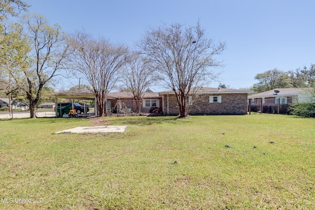 view of yard featuring a carport