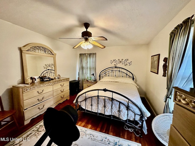 bedroom featuring hardwood / wood-style floors and ceiling fan