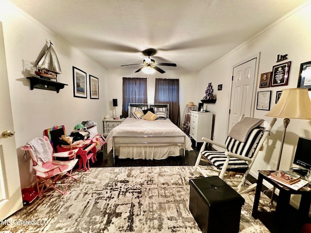 bedroom featuring ceiling fan and ornamental molding