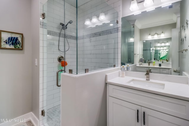 bathroom featuring vanity and a shower with shower door