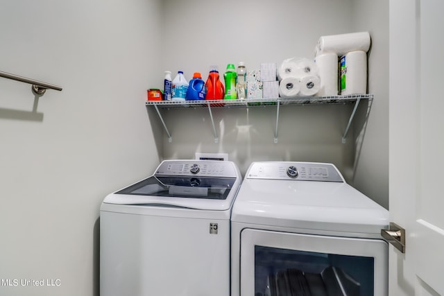 washroom with independent washer and dryer