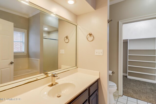 2616 Rue Palafox, Biloxi, MS 39531 - full bath featuring toilet, vanity, tile patterned flooring, a bath, and an enclosed shower