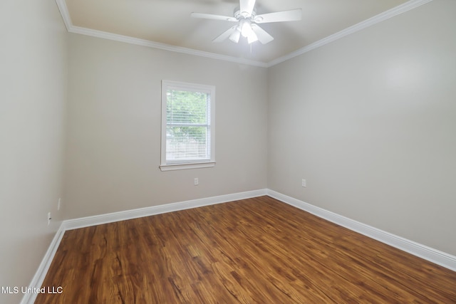 2616 Rue Palafox, Biloxi, MS 39531 - unfurnished room with dark wood-type flooring, baseboards, crown molding, and ceiling fan