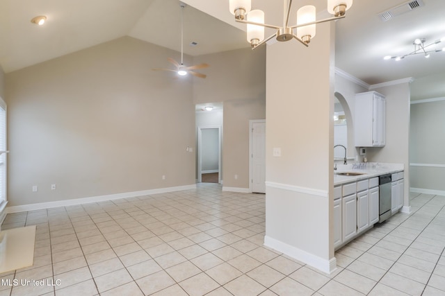 2616 Rue Palafox, Biloxi, MS 39531 - kitchen featuring a sink, stainless steel dishwasher, light countertops, light tile patterned floors, and crown molding