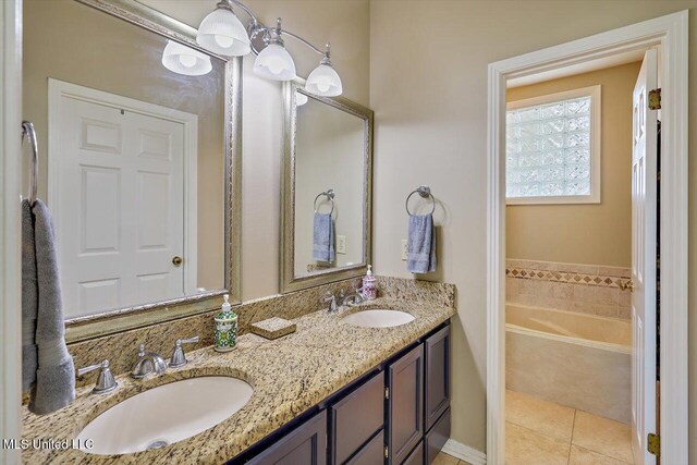 911 Tetbury Pl, Brandon, MS 39047 - bathroom with double vanity, tile patterned flooring, and a tub