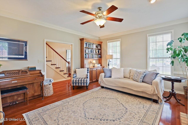 911 Tetbury Pl, Brandon, MS 39047 - living area featuring wood finished floors, a ceiling fan, stairs, crown molding, and baseboards
