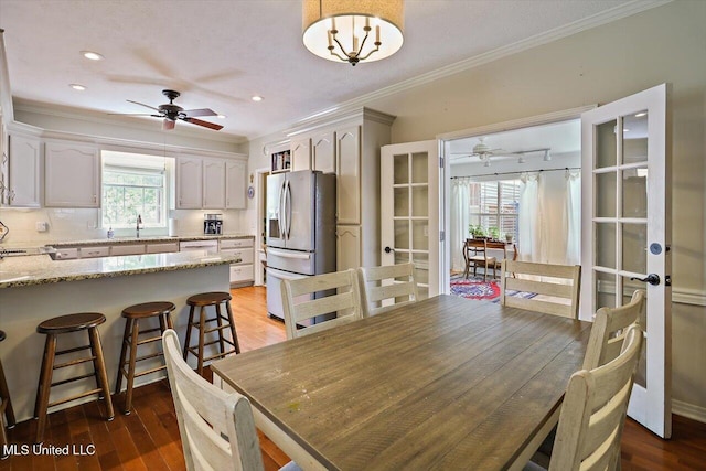 911 Tetbury Pl, Brandon, MS 39047 - dining area with french doors, ceiling fan, crown molding, wood finished floors, and recessed lighting