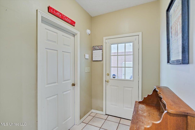 911 Tetbury Pl, Brandon, MS 39047 - doorway with light tile patterned flooring and baseboards