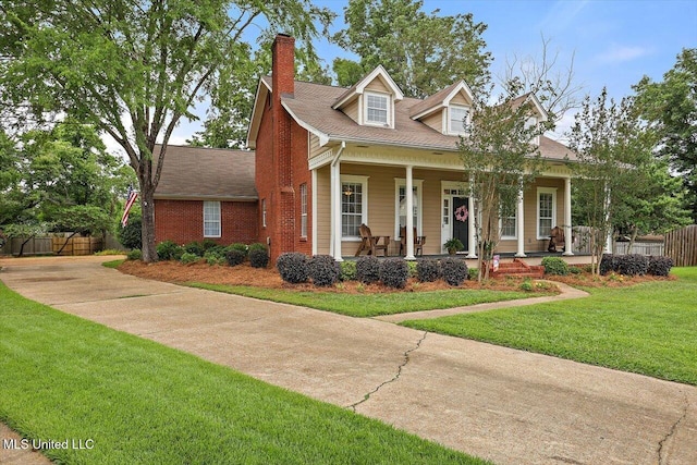 911 Tetbury Pl, Brandon, MS 39047 - view of front of property with a chimney, a porch, and brick siding