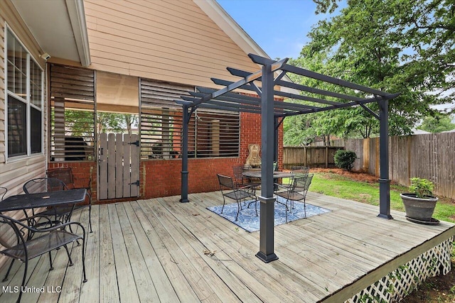 911 Tetbury Pl, Brandon, MS 39047 - wooden deck with outdoor dining area, a fenced backyard, and a pergola