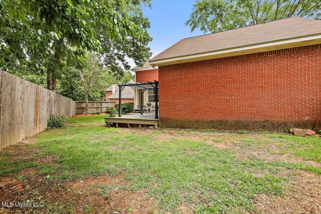 911 Tetbury Pl, Brandon, MS 39047 - view of yard featuring a wooden deck and a pergola
