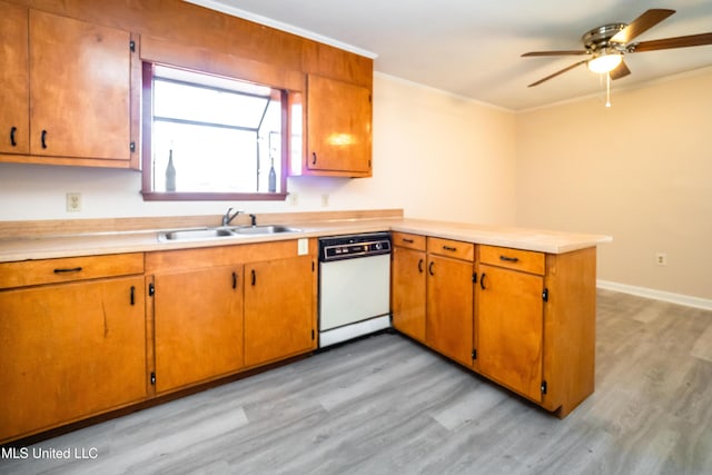 kitchen featuring sink, dishwasher, light hardwood / wood-style flooring, and kitchen peninsula