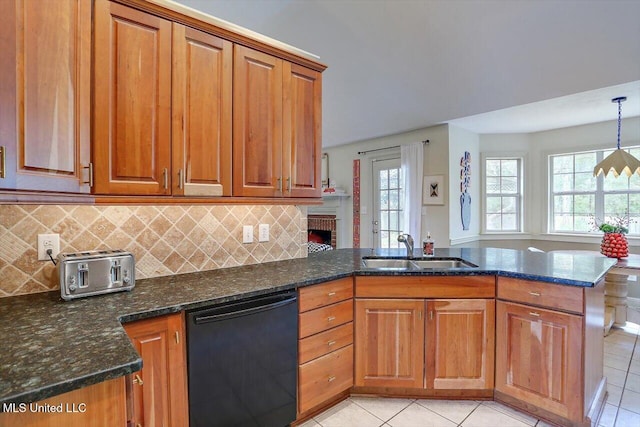 kitchen featuring light tile patterned flooring, hanging light fixtures, sink, dishwasher, and kitchen peninsula