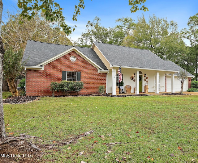 single story home featuring a front lawn and a garage