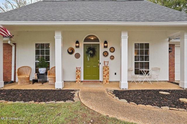 doorway to property featuring covered porch