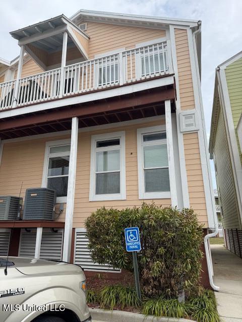 view of property exterior with cooling unit