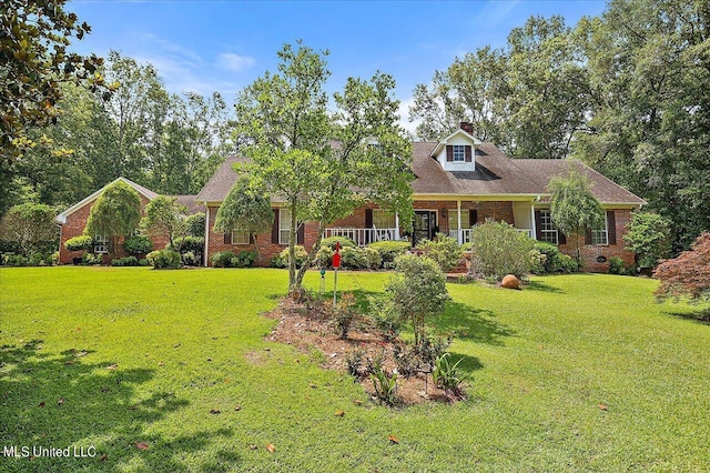 1600 Pine Hill Dr, Raymond, MS 39154 - cape cod-style house featuring brick siding, a front yard, a chimney, and a porch